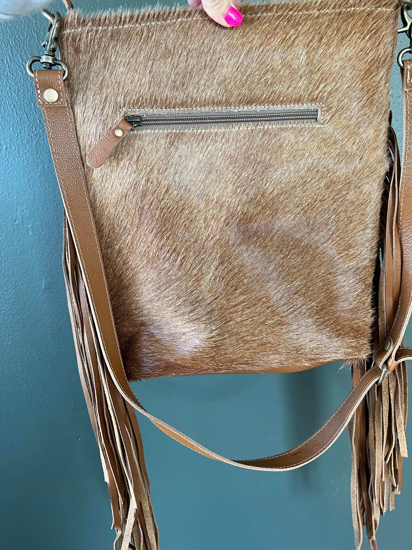 Concho and cowhide purse